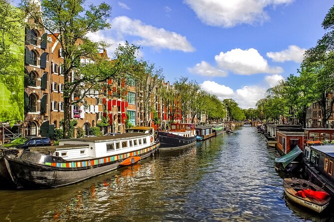 Amsterdam Day Trip from Brussels With Cheese, Clogs and Windmills - Arriving in Amsterdam: Dam Square first, then you choose your pace