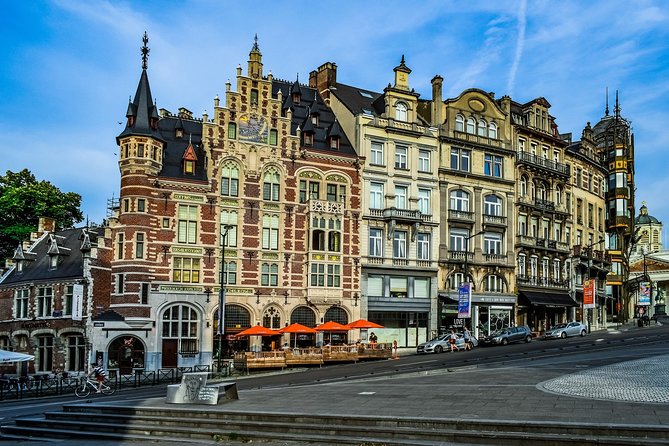 Brussels Private Walking Tour With A Professional Guide - Historic shopfronts and WWII-surviving buildings in the city center