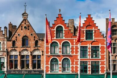 From Brussels: Bruges & Ghent Day Tour - 2 Fairytale Cities - Ghent Walking: Saint Bavo Cathedral, Graslei, and medieval power
