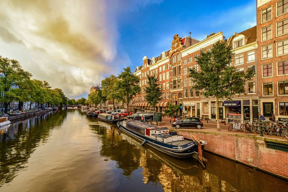From Brussels: Cheese, Clogs & Windmills Amsterdam Day Trip - The 30-Minute Canal Cruise: A Short Slice of Amsterdam Magic