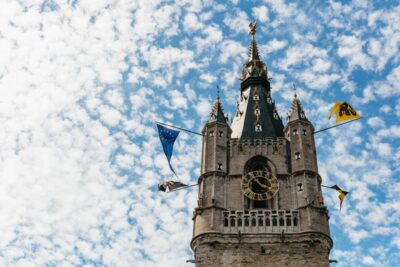 From Brussels: Guided Day Trip to Bruges and Ghent - Bruges Walking Tour: Canals, Belfries, and the 1245 Begijnhof